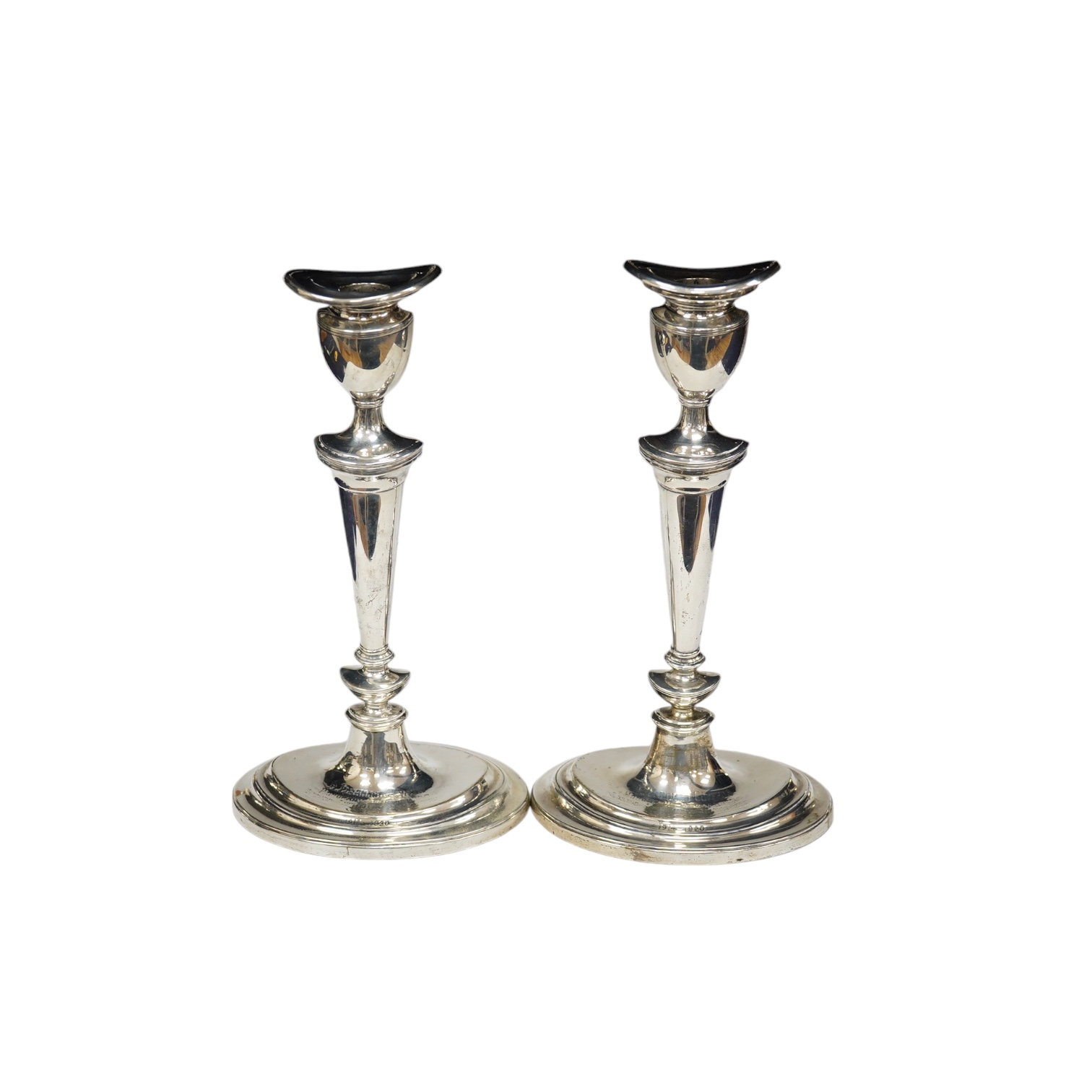 A pair of George V silver oval candlesticks, with engraved inscription, Hawksworth, Eyre & Co, Sheffield, 1919, 30cm, weighted. Condition - fair